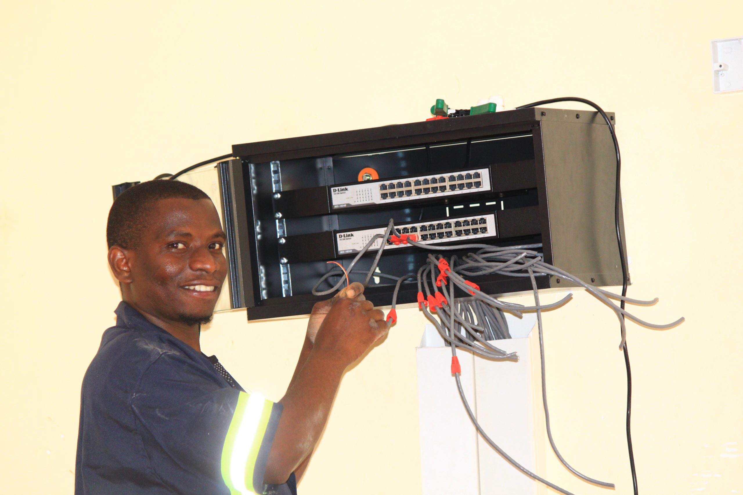 Rashidi Chambo providing EdTech technical support for Camara Education Tanzania digital learning and ICT systems in schools