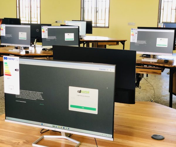 alt="Installation of ICT devices in Ubora STEM computer lab supported by Camara Education Tanzania"
