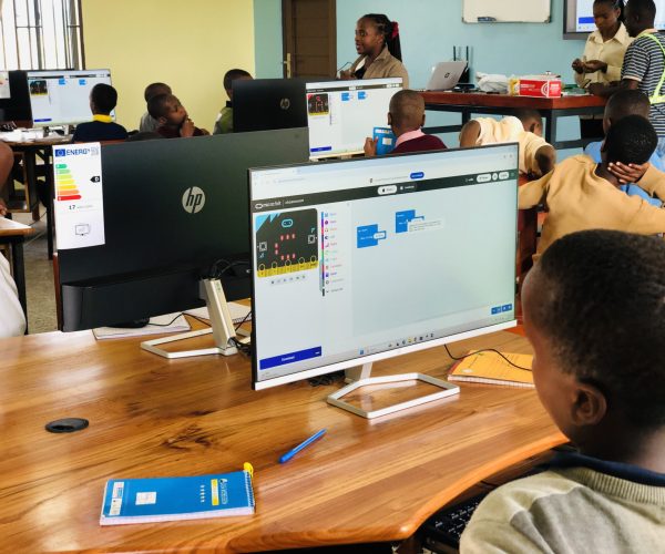 Students engaged in EdTech in Tanzania through Ubora Project computer training session supported by Camara Education Tanzania